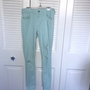 Pastel green, ripped jeans